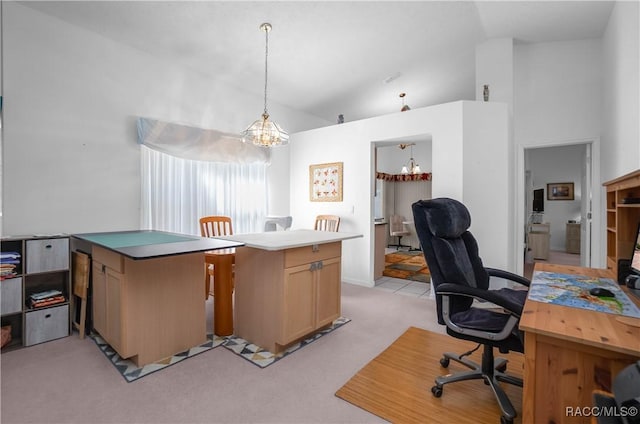 carpeted home office featuring high vaulted ceiling