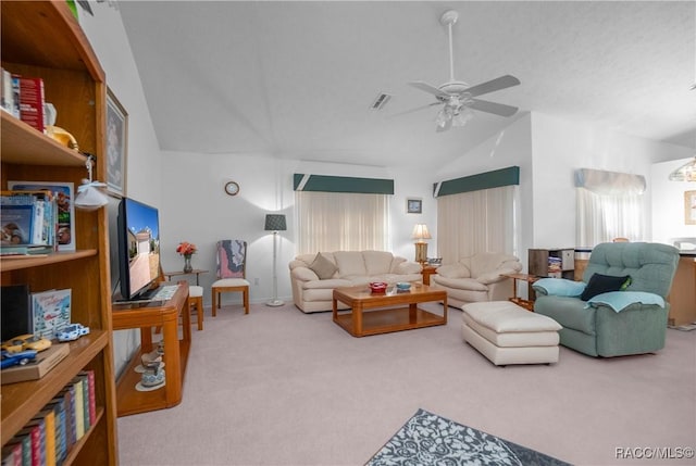 carpeted living room with lofted ceiling and ceiling fan