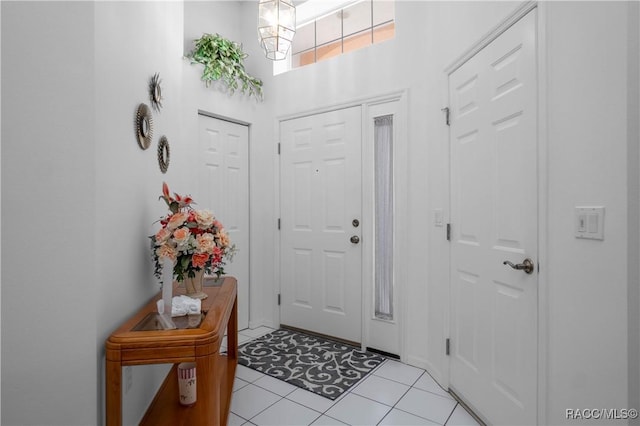 foyer entrance with light tile patterned flooring