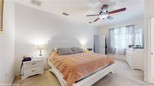 bedroom featuring ceiling fan and light colored carpet