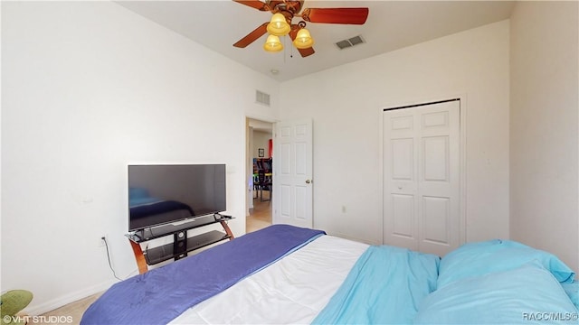 carpeted bedroom with a closet and ceiling fan