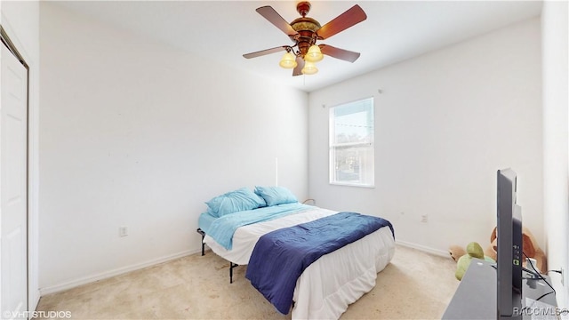 carpeted bedroom featuring ceiling fan