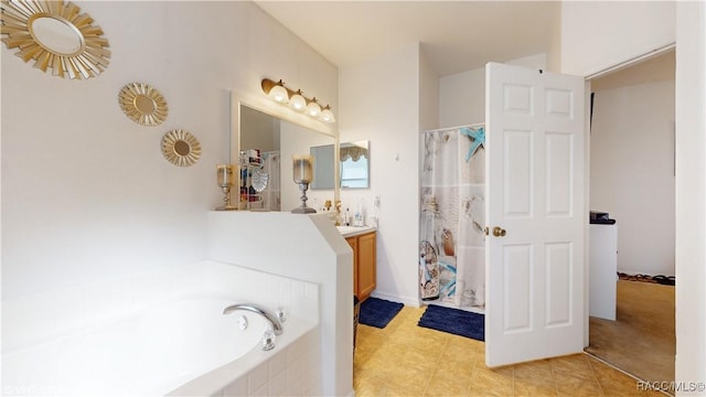 bathroom featuring vanity and separate shower and tub