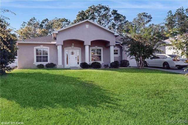 ranch-style home featuring a front lawn