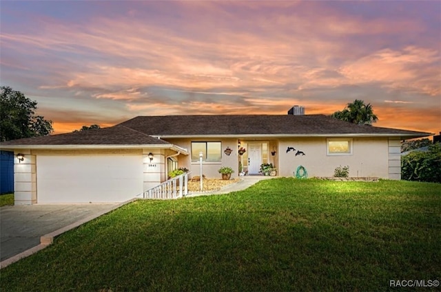 3945 N Timucua Pt, Crystal River, FL 34428 - ranch-style house featuring an attached garage, stucco siding, driveway, and a front lawn