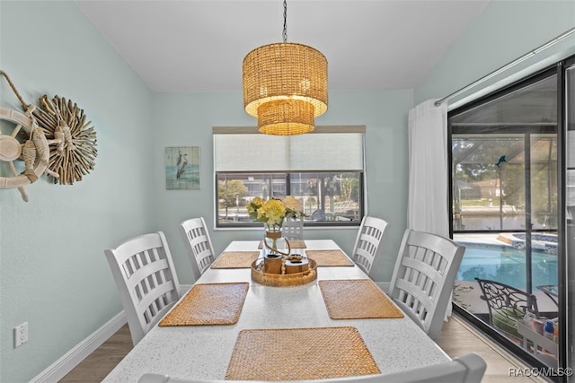 3945 N Timucua Pt, Crystal River, FL 34428 - dining space featuring baseboards and wood finished floors