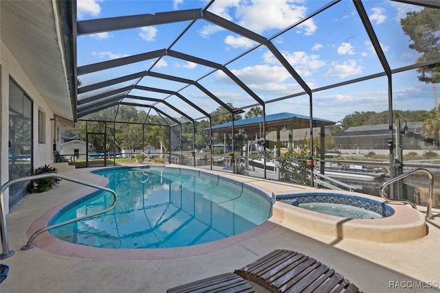 3945 N Timucua Pt, Crystal River, FL 34428 - view of pool with a pool with connected hot tub, a patio area, and a lanai