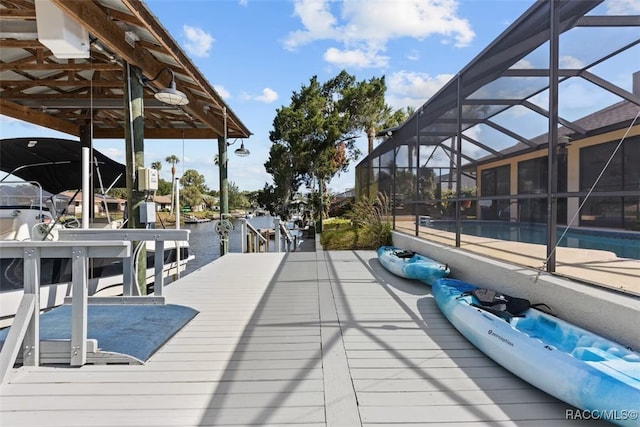 3945 N Timucua Pt, Crystal River, FL 34428 - deck with glass enclosure, a boat dock, an outdoor pool, and boat lift
