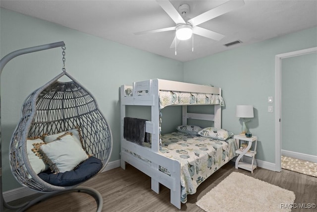 3945 N Timucua Pt, Crystal River, FL 34428 - bedroom with ceiling fan, baseboards, visible vents, and wood finished floors