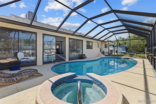3945 N Timucua Pt, Crystal River, FL 34428 - view of pool featuring a patio area, glass enclosure, and a pool with connected hot tub