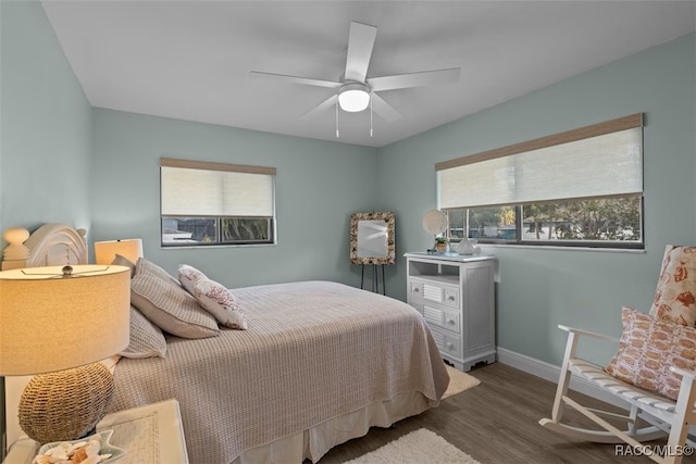 3945 N Timucua Pt, Crystal River, FL 34428 - bedroom featuring a ceiling fan, wood finished floors, and baseboards