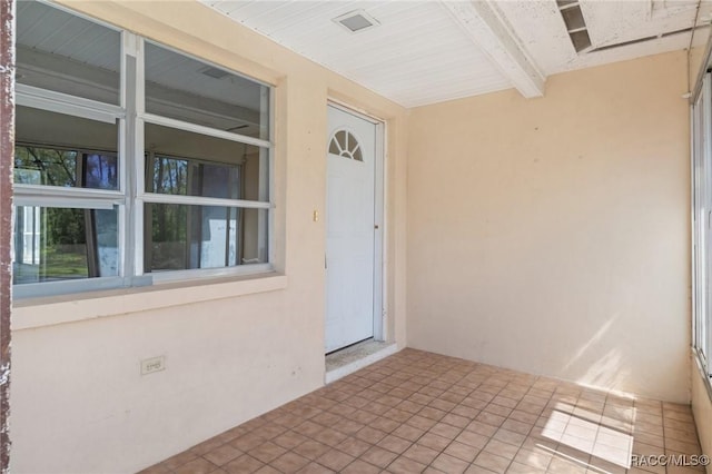 entrance to property with stucco siding