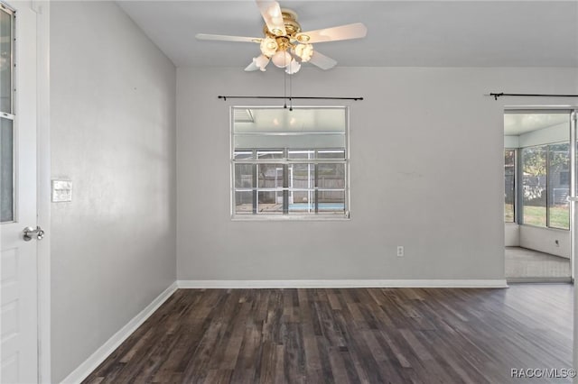 unfurnished room with ceiling fan, baseboards, and wood finished floors