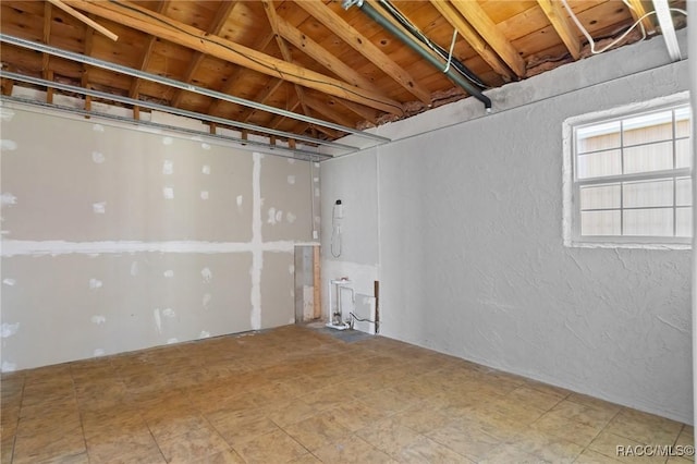 basement featuring a textured wall