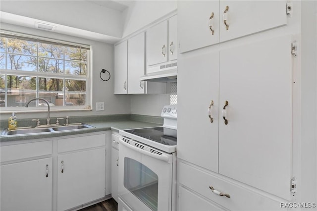 kitchen with white electric range, a sink, white cabinetry, and under cabinet range hood