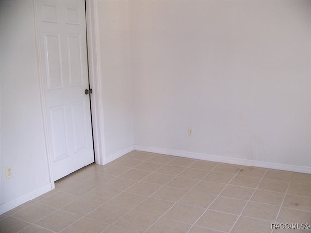 spare room with light tile patterned floors