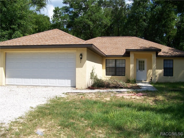 single story home with a garage