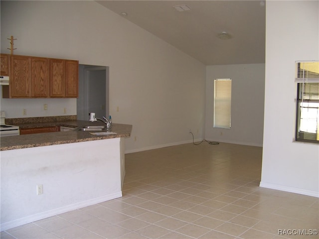 kitchen featuring white range oven, sink, high vaulted ceiling, and light tile patterned flooring