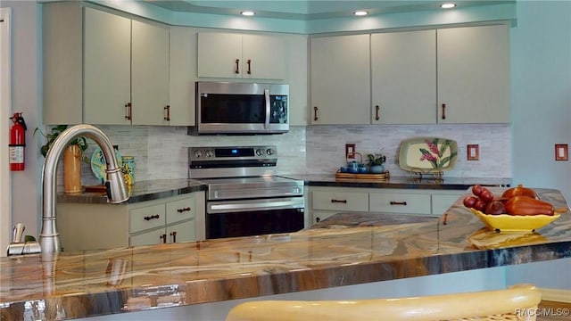 kitchen featuring backsplash and appliances with stainless steel finishes