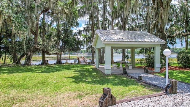 view of yard with a gazebo and a water view