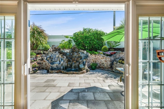 doorway with stone tile flooring