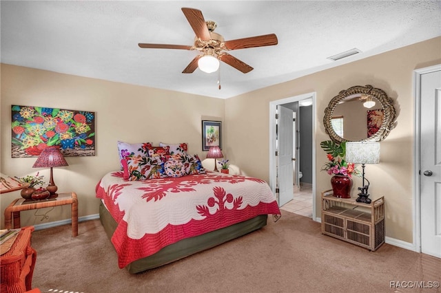 bedroom featuring baseboards, carpet, visible vents, and ceiling fan