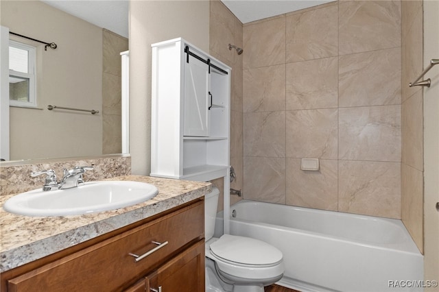 full bathroom featuring vanity, toilet, and tiled shower / bath