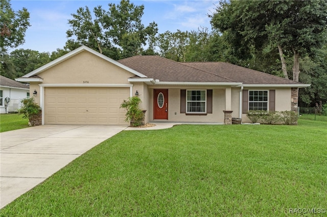 ranch-style home featuring a front yard and a garage