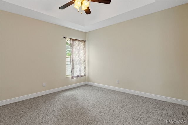 empty room with carpet and ceiling fan