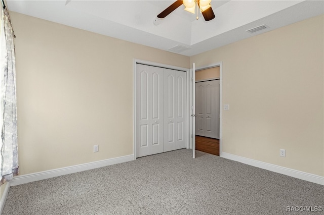 unfurnished bedroom with carpet floors, a closet, and ceiling fan