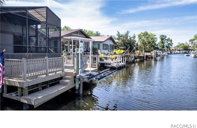 dock area featuring a water view and a lanai