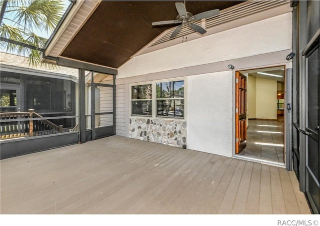 wooden terrace featuring ceiling fan