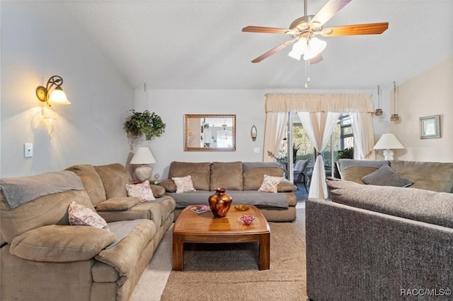 living area with lofted ceiling, light carpet, and ceiling fan