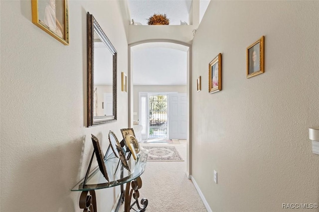 1923 W Mcneal Dr, Citrus Springs, FL 34434 - hallway with carpet flooring, arched walkways, and a textured wall