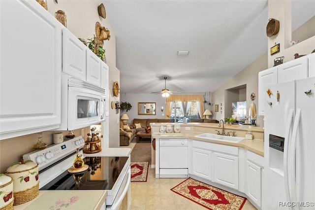 kitchen with white cabinetry, sink, and white appliances