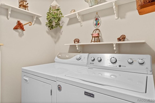 washroom with laundry area and washing machine and dryer