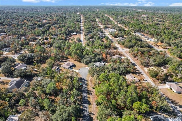 1923 W Mcneal Dr, Citrus Springs, FL 34434 - aerial view of property and surrounding area featuring a heavily wooded area