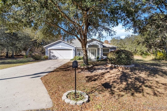 view of front of home featuring a garage and concrete driveway