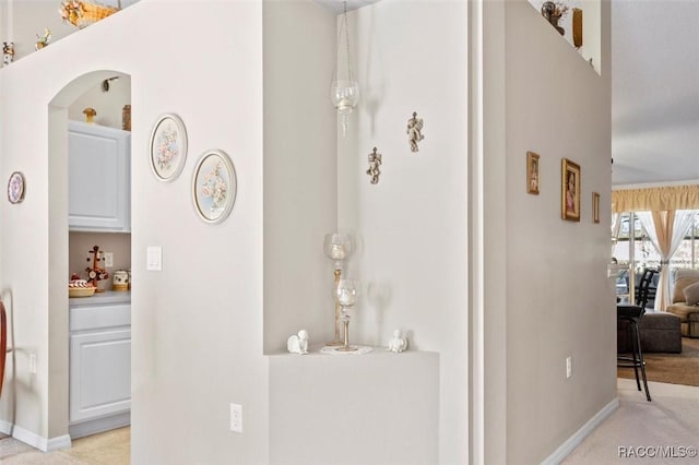 1923 W Mcneal Dr, Citrus Springs, FL 34434 - hallway featuring arched walkways and light carpet