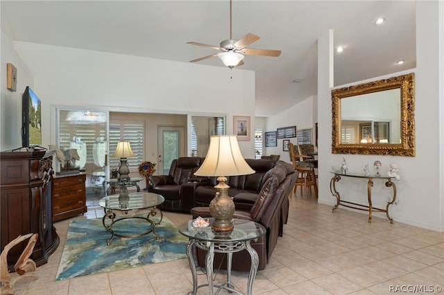 tiled living room featuring ceiling fan and high vaulted ceiling