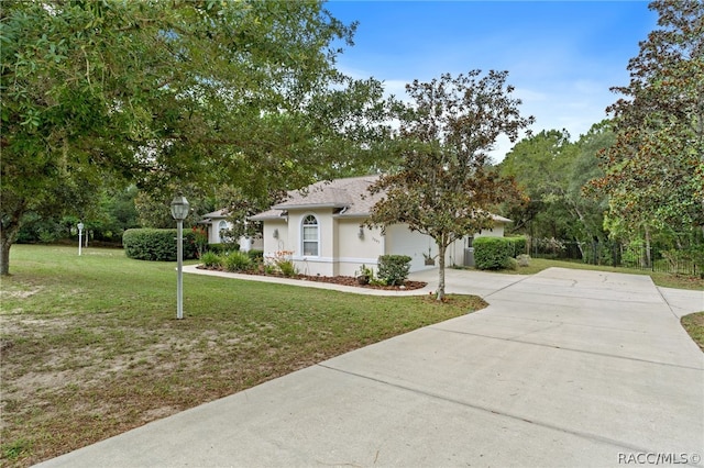 view of front facade with a front yard and a garage