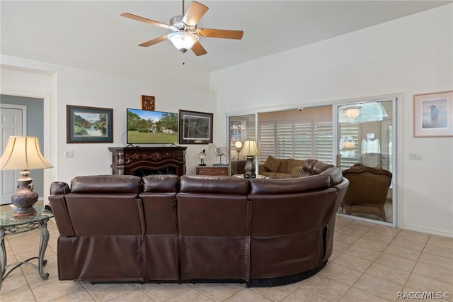 living room with ceiling fan and light tile patterned floors