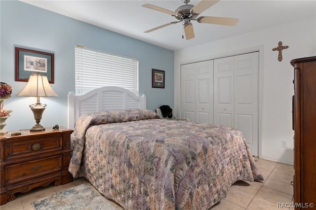 tiled bedroom with a closet and ceiling fan