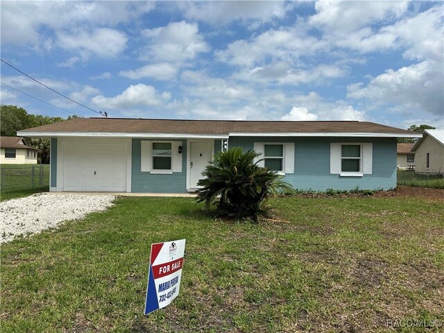 10765 W Spring Cir, Crystal River, FL 34428 - single story home with an attached garage and driveway
