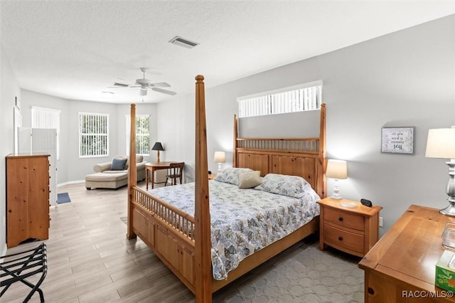 9989 N Langdon Rd, Citrus Springs, FL 34434 - bedroom with ceiling fan and a textured ceiling