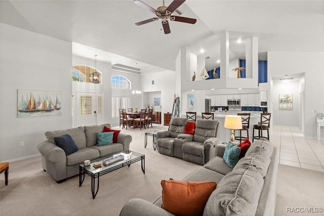 9989 N Langdon Rd, Citrus Springs, FL 34434 - living room with high vaulted ceiling, light colored carpet, and a ceiling fan