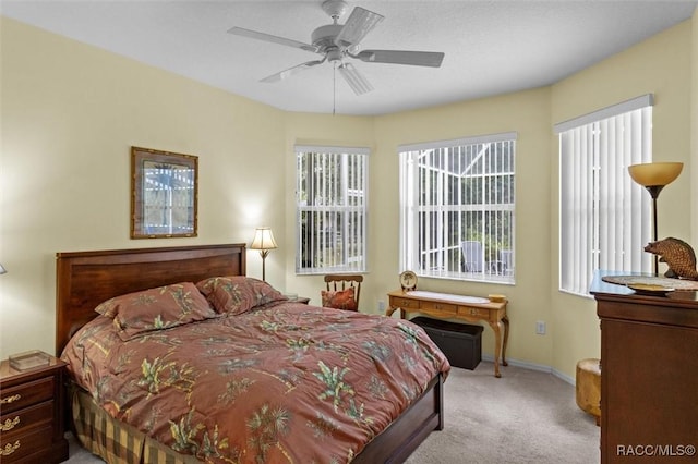 9989 N Langdon Rd, Citrus Springs, FL 34434 - carpeted bedroom with baseboards and ceiling fan