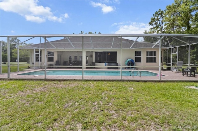 9989 N Langdon Rd, Citrus Springs, FL 34434 - back of house with a lawn, an outdoor pool, and a patio area