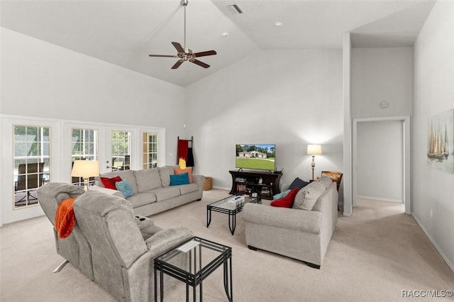 9989 N Langdon Rd, Citrus Springs, FL 34434 - living room featuring light carpet, high vaulted ceiling, and ceiling fan