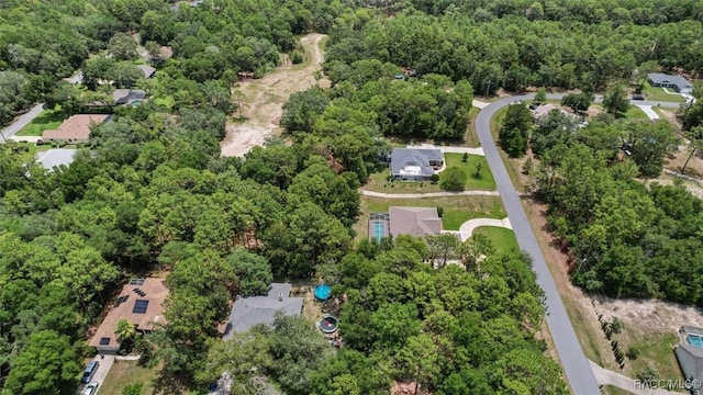 9989 N Langdon Rd, Citrus Springs, FL 34434 - aerial view of property and surrounding area featuring a heavily wooded area